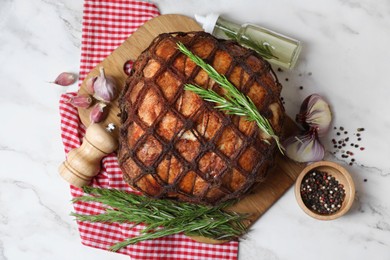 Photo of Delicious baked ham served on white marble table, flat lay