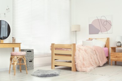 Photo of Teenager's room interior with stylish furniture and beautiful decor elements