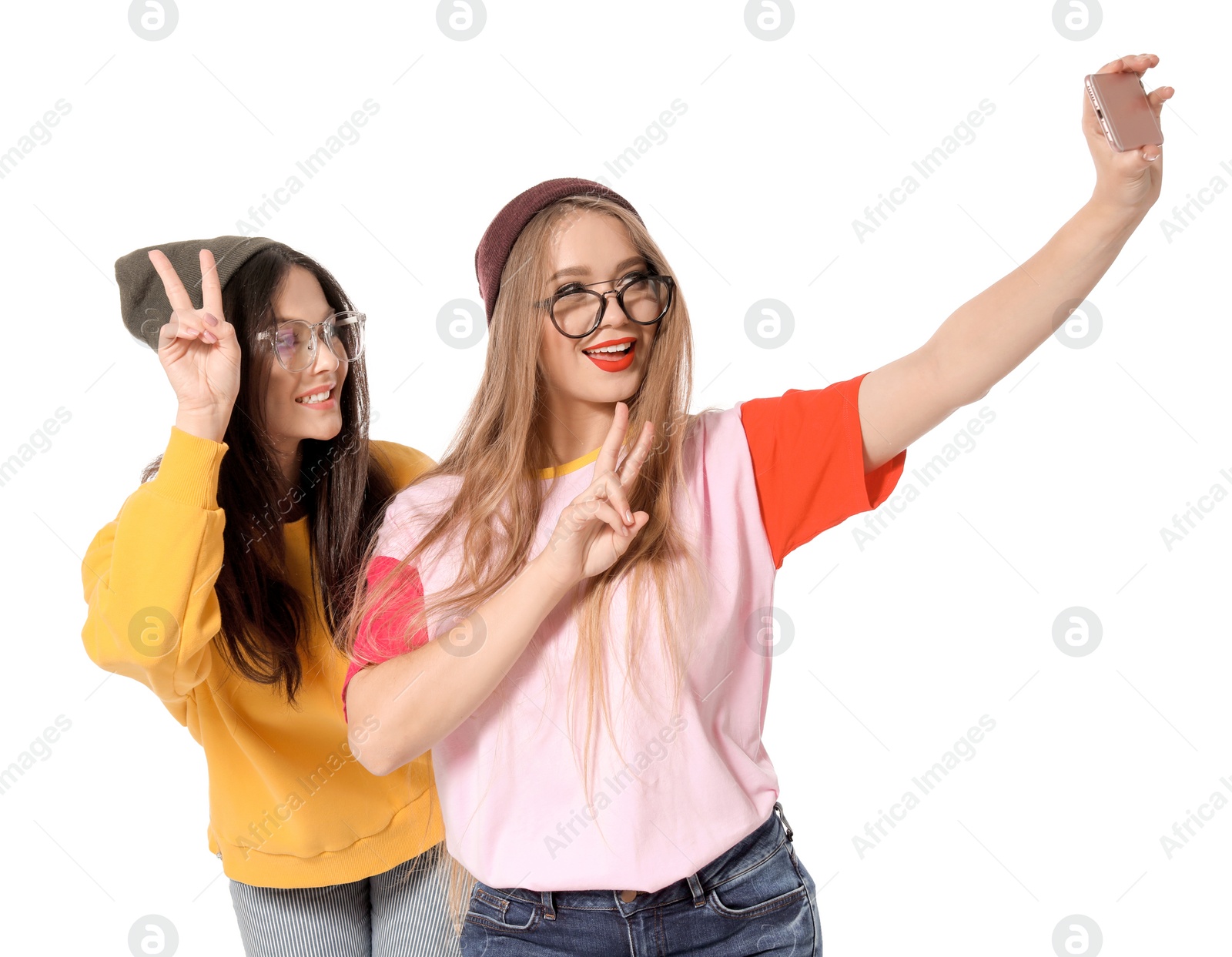 Photo of Attractive young women taking selfie on white background