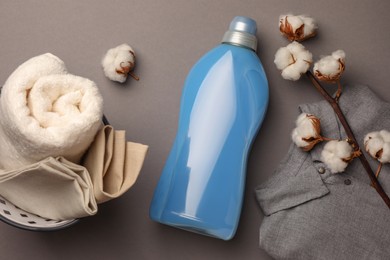 Photo of Flat lay composition with bottle of fabric softener on gray background