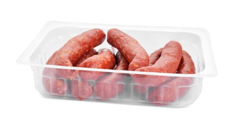 Photo of Plastic container with sausages isolated on white. Meat product