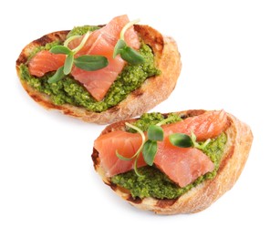 Photo of Delicious bruschettas with salmon, pesto sauce and microgreens on white background, top view