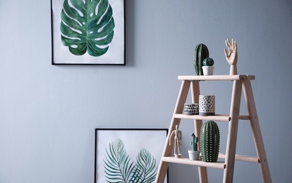 Photo of Stylish wooden ladder in modern room interior