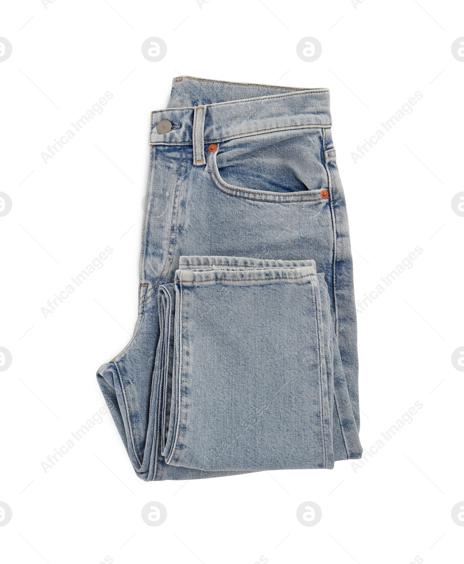 Photo of Light blue jeans isolated on white, top view. Stylish clothes