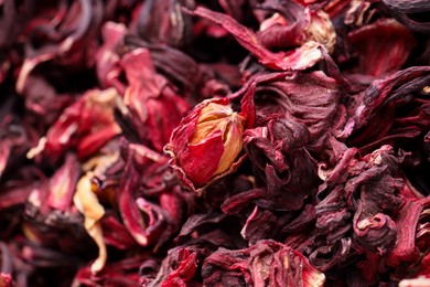 Photo of Dry hibiscus tea as background, closeup view