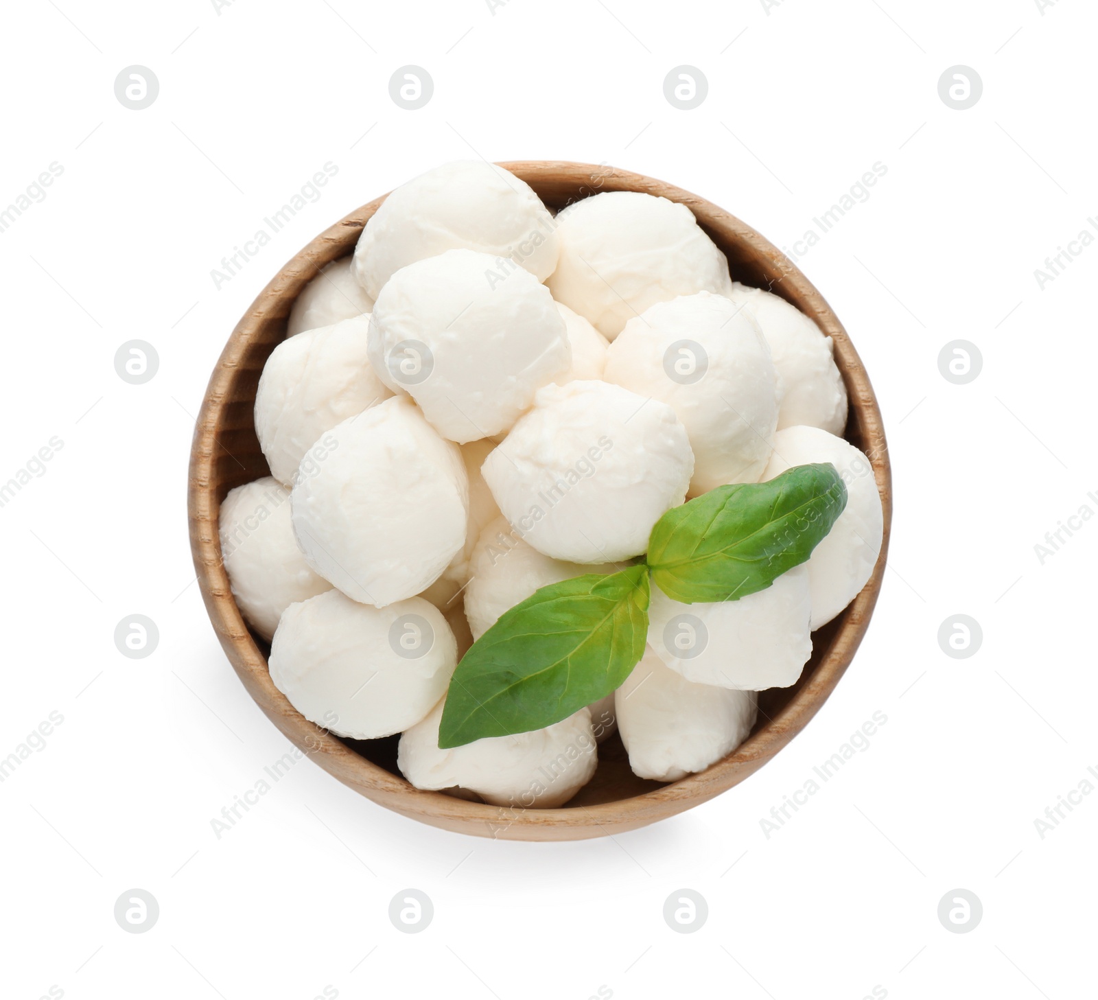 Photo of Wooden bowl with mozzarella cheese balls and basil on white background, top view