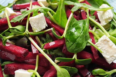 Delicious salad with beet as background, closeup