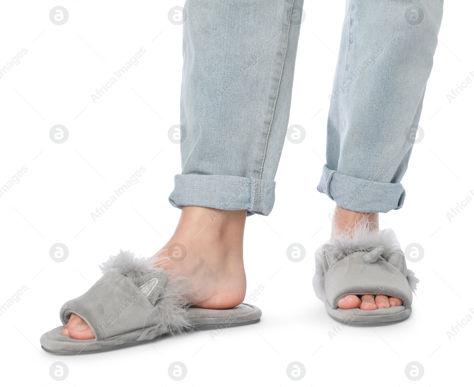 Photo of Woman in grey soft slippers on white background, closeup