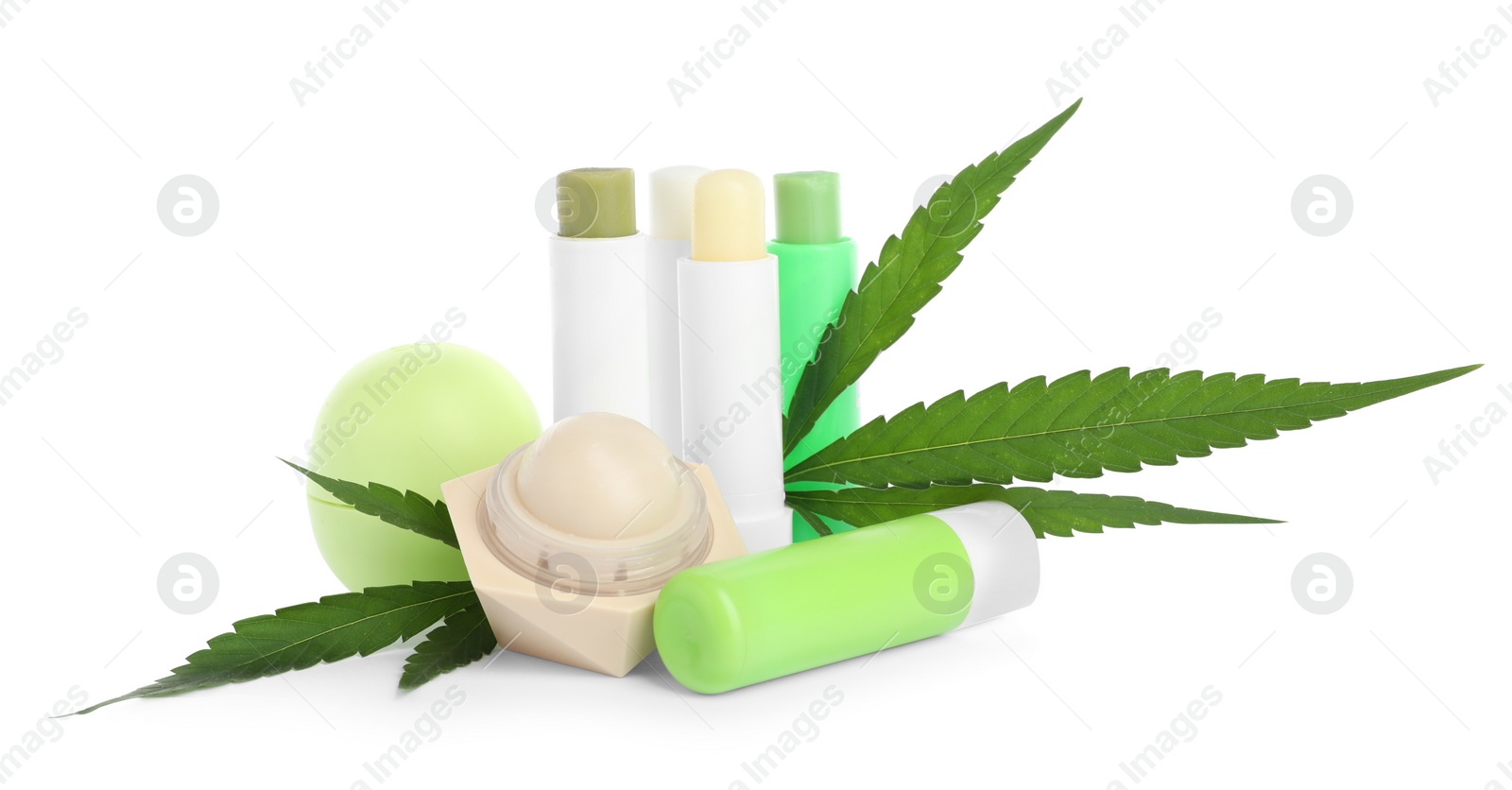 Photo of Different hemp cosmetics and green leaves on white background