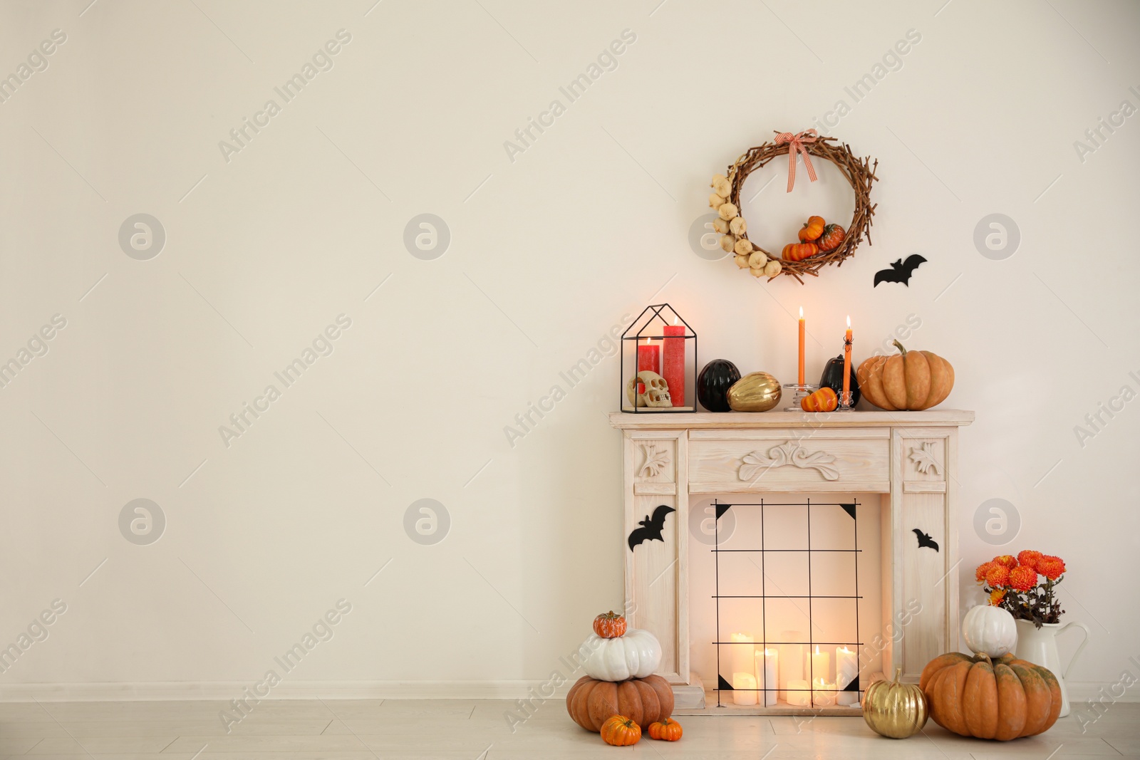 Photo of Modern room decorated for Halloween, space for text. Idea for festive interior