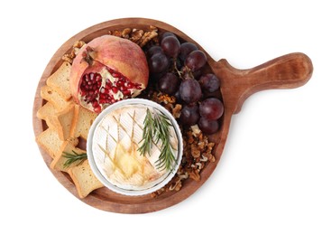 Photo of Board with tasty baked camembert, croutons, grapes, walnuts and pomegranate isolated on white, top view