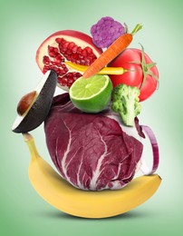 Image of Stack of different vegetables and fruits on pale light green background