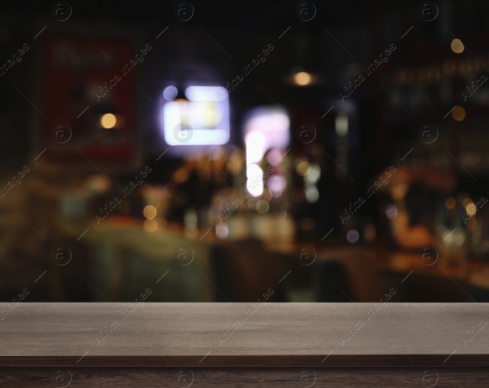 Image of Empty wooden surface and blurred view of bar interior. Space for design