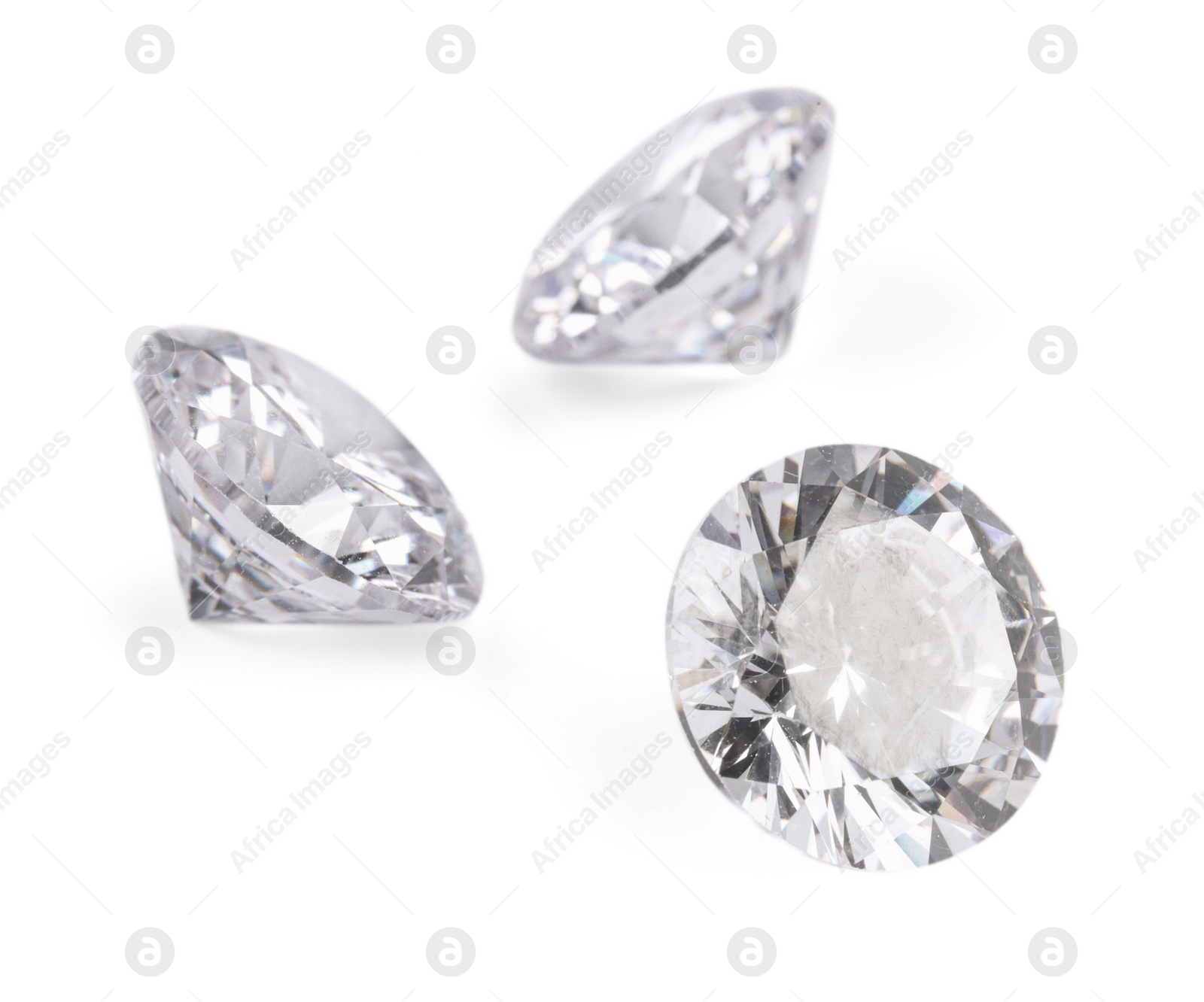 Photo of Three beautiful shiny diamonds isolated on white