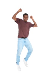 Photo of Full length portrait of African-American man jumping on white background