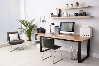 Modern computer on table in office interior. Stylish workplace