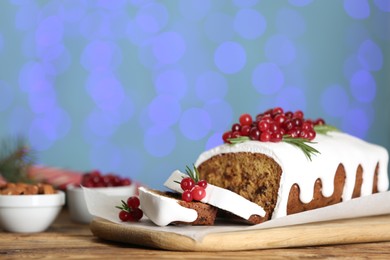 Traditional Christmas cake on wooden table. Classic recipe