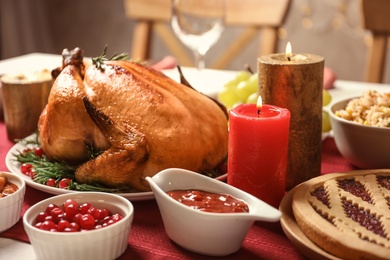 Photo of Traditional festive dinner with delicious roasted turkey served on table