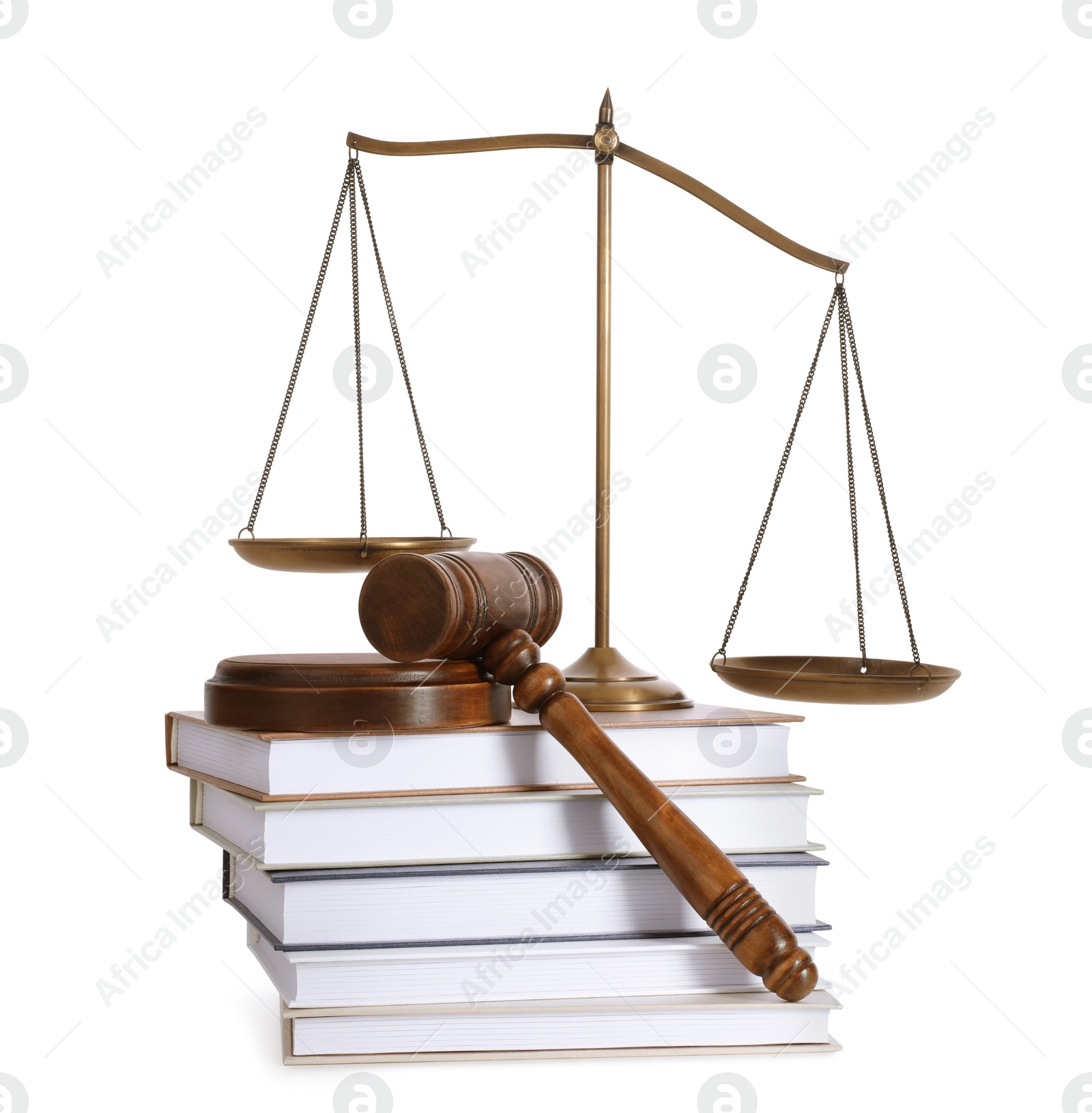 Photo of Wooden gavel, books and scales of justice on white background