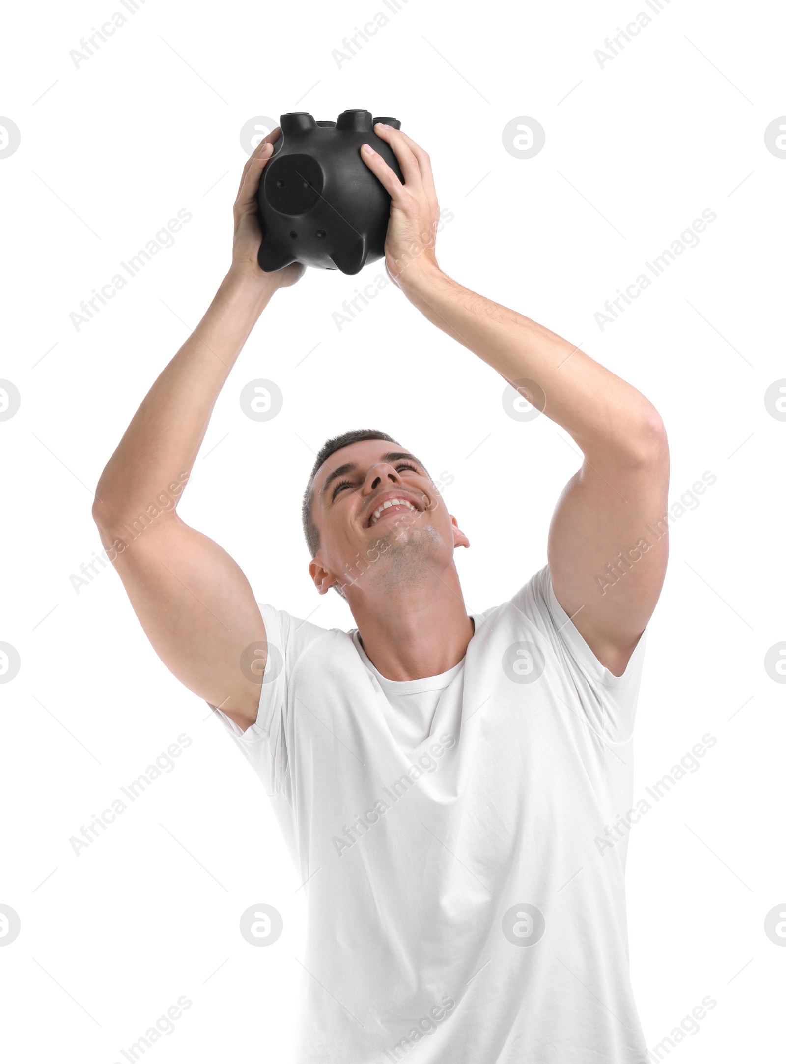 Photo of Handsome young man with piggy bank on white background