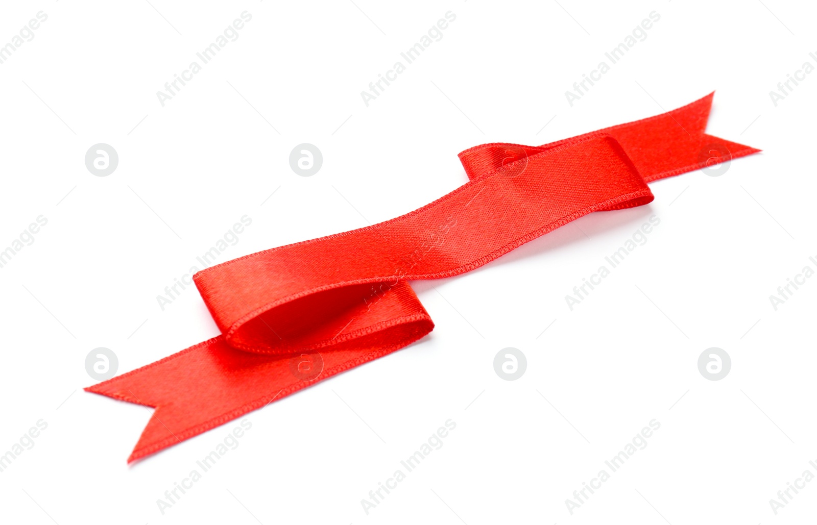 Photo of Simple red ribbon on white background. Festive decoration