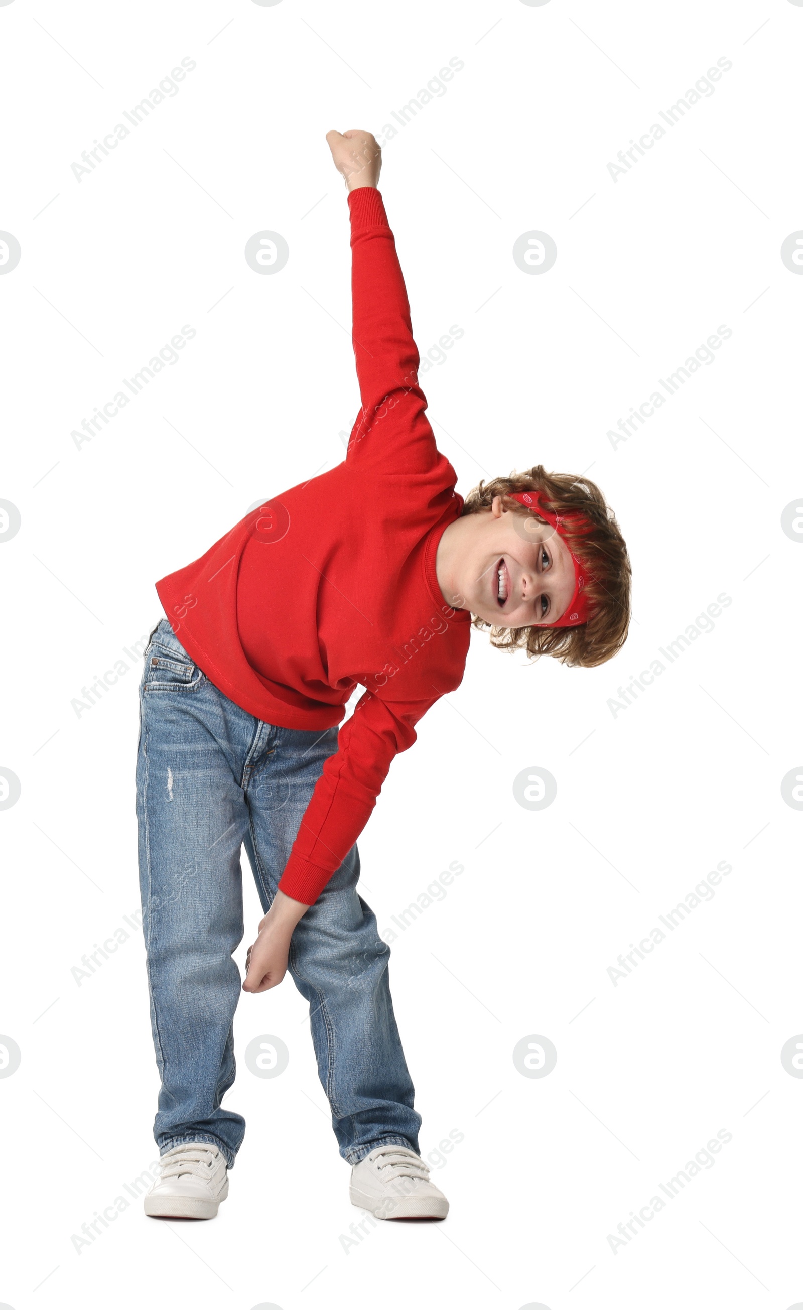 Photo of Happy little boy dancing on white background