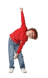 Happy little boy dancing on white background