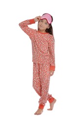 Photo of Cute girl wearing pajamas and sleeping mask on white background