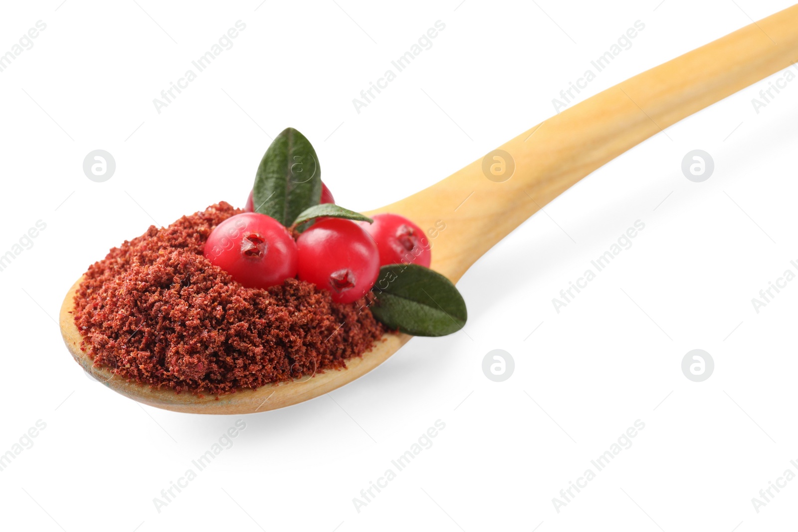 Photo of Wooden spoon with dried cranberry powder, fresh berries and green leaves isolated on white