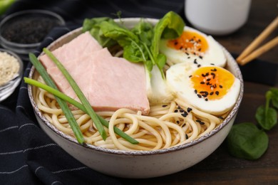 Photo of Delicious ramen with meat on table, closeup. Noodle soup