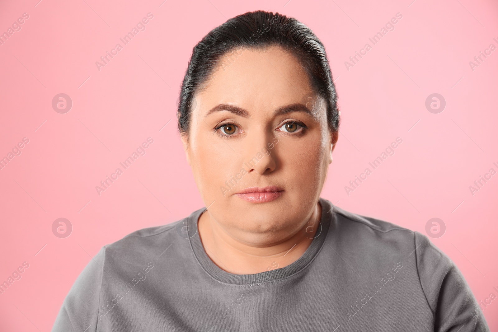 Photo of Woman with double chin on pink background