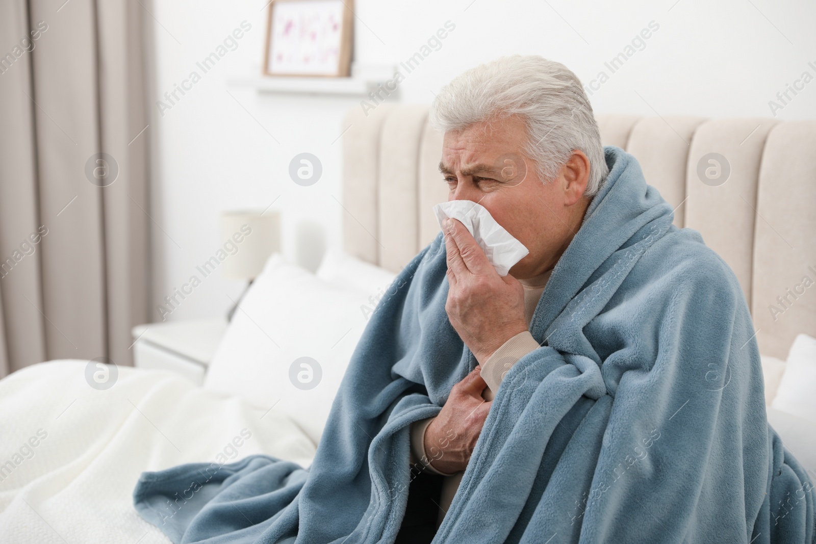 Photo of Mature suffering from cold at home. Dangerous virus