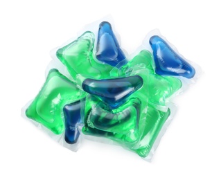 Photo of Heap of laundry capsules on white background, top view