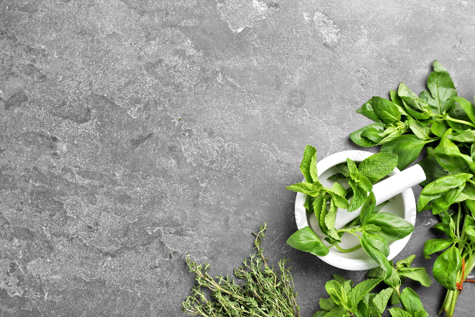 Photo of Flat lay composition with fresh green herbs on grey background