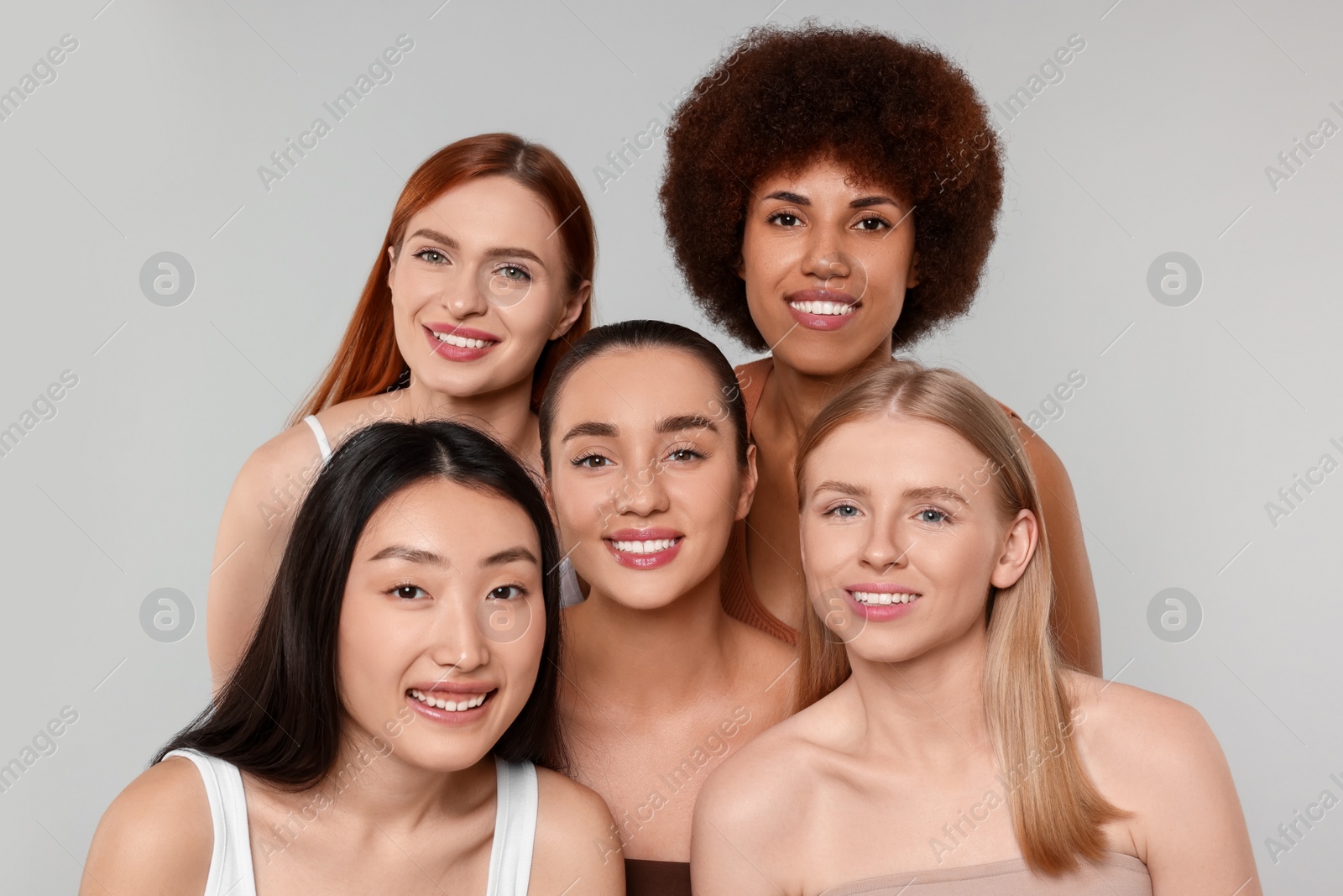 Photo of Portrait of beautiful young women on light grey background