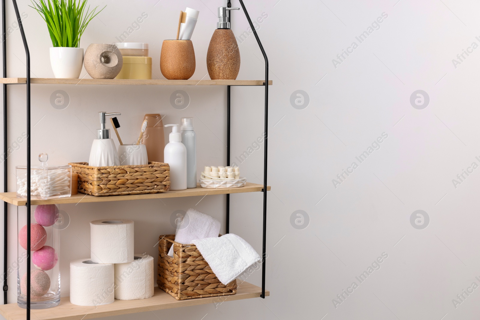 Photo of Different bath accessories, personal care products and artificial plant indoors, space for text