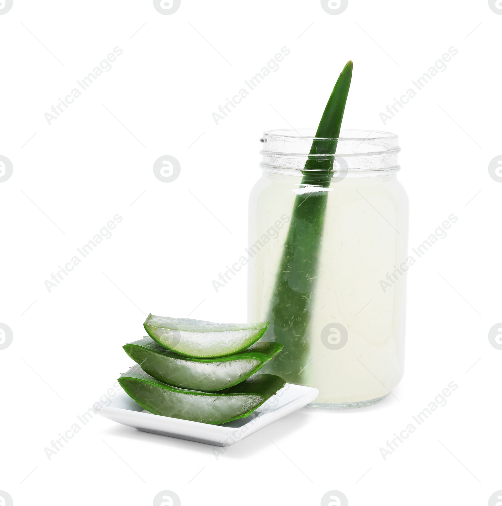 Photo of Fresh aloe juice in jar and cut leaves isolated on white