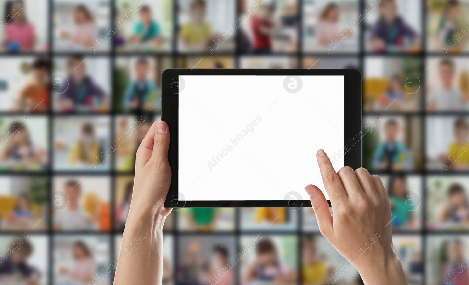 Image of Distance education. Teacher using tablet for online lesson during quarantine and lockdown due coronavirus pandemic, closeup