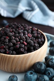 Photo of Freeze dried and fresh blueberries on table, closeup