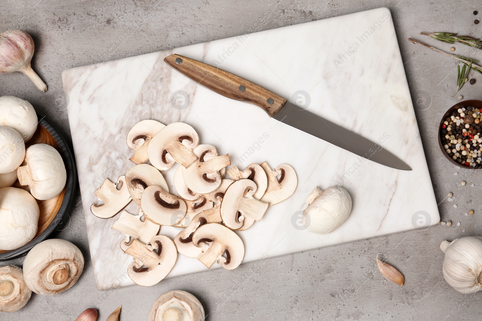 Photo of Flat lay composition with fresh champignon mushrooms on table