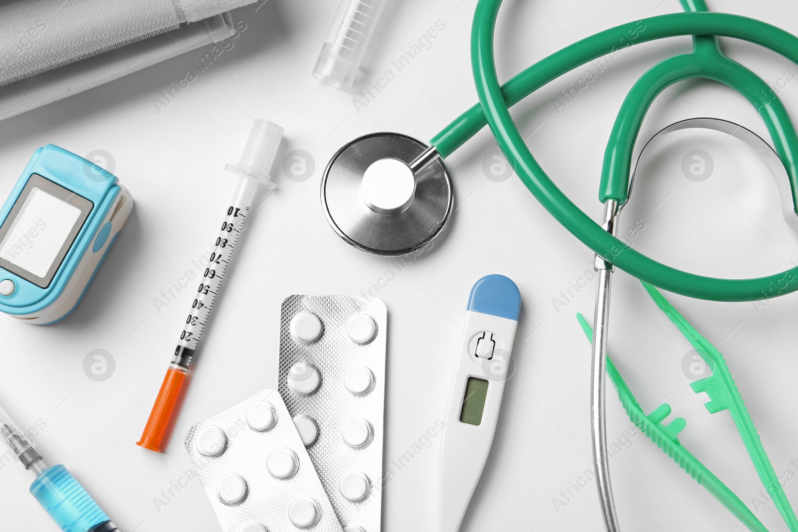 Photo of Flat lay composition with different medical objects on white background