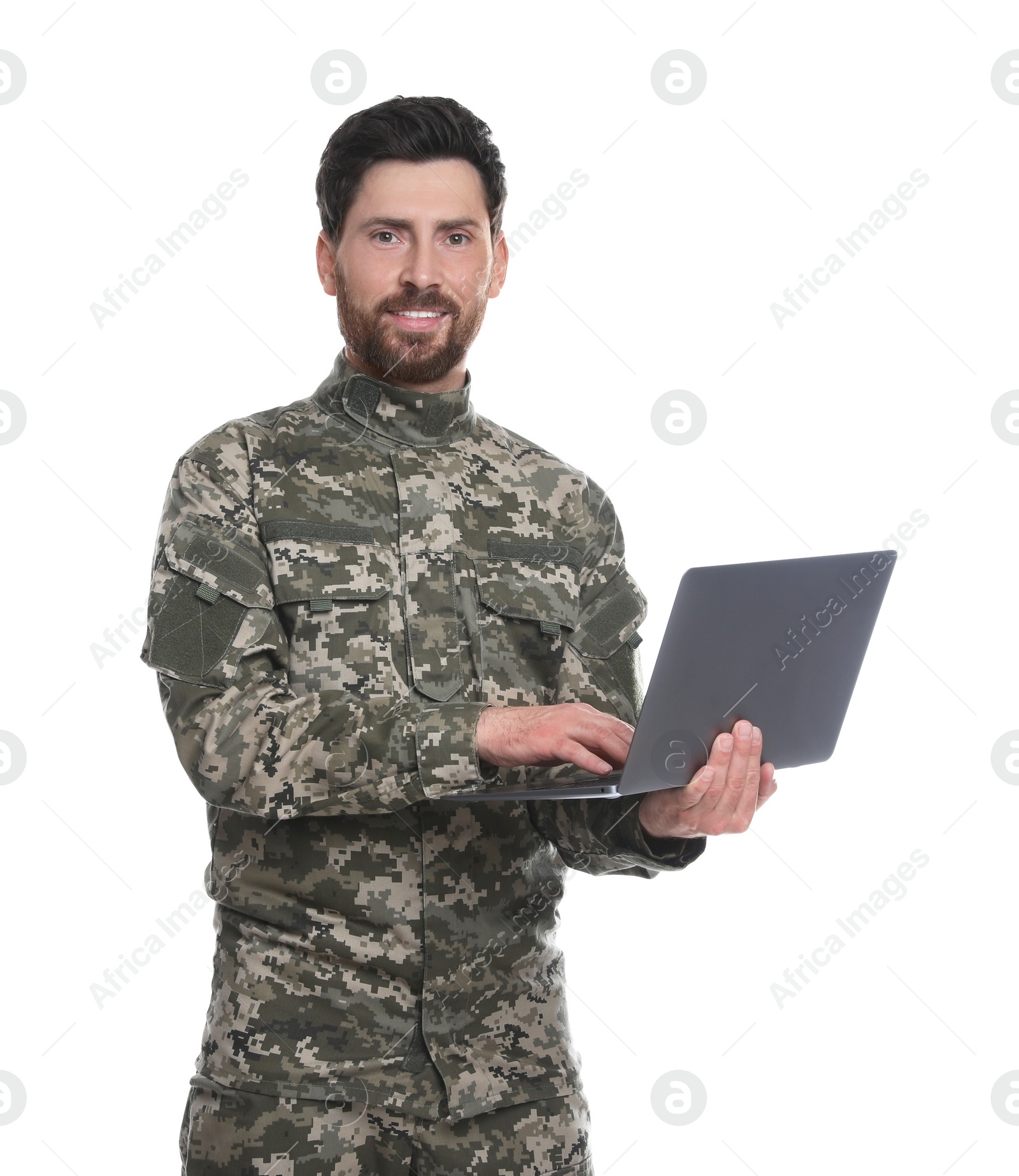 Photo of Happy soldier using laptop on white background. Military service