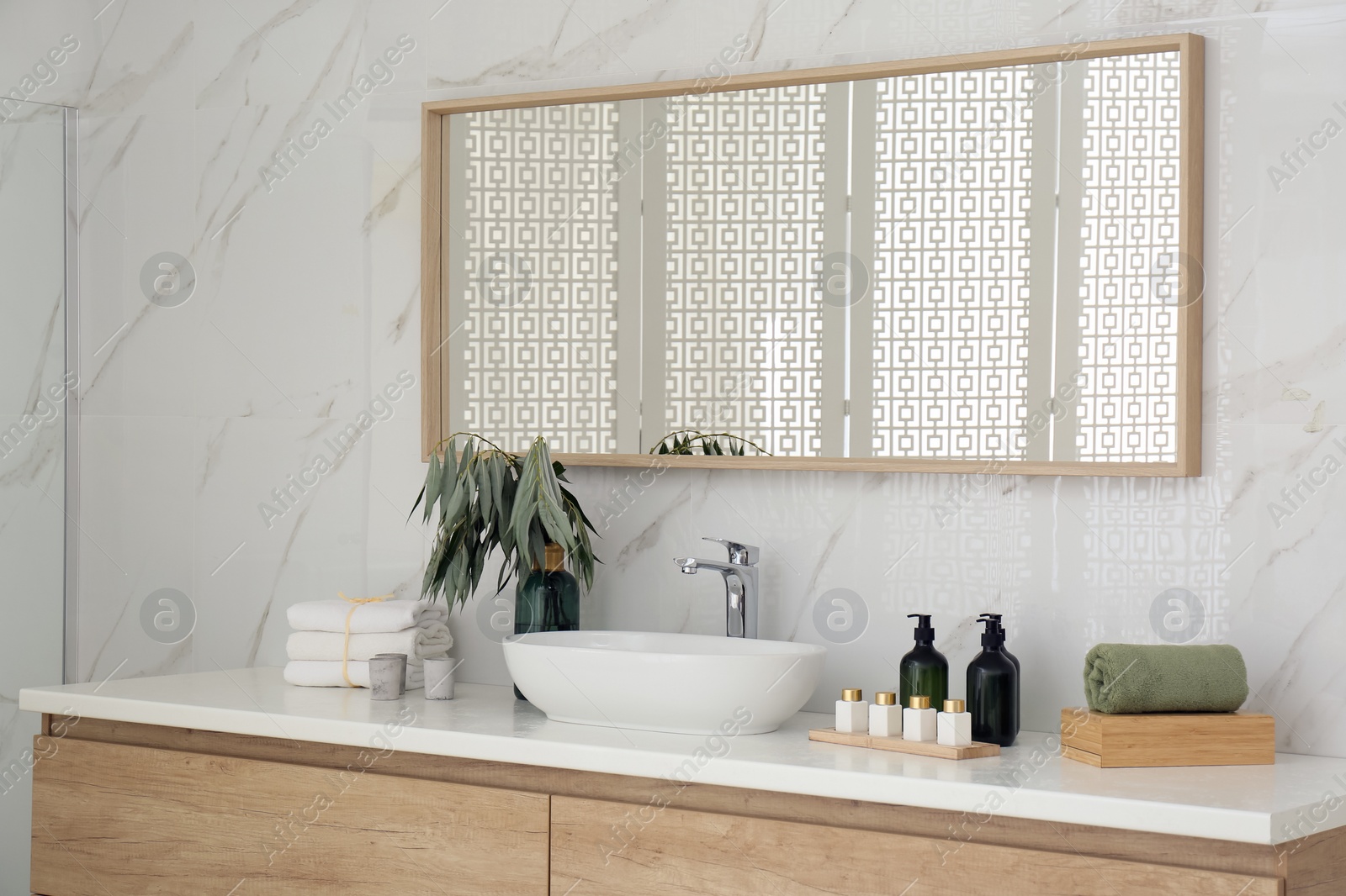 Photo of Modern bathroom interior with stylish mirror and vessel sink