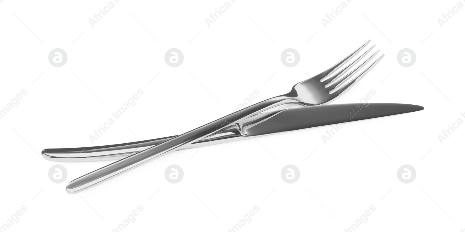 Photo of Fork and knife isolated on white. Stylish shiny cutlery set