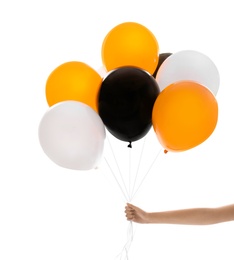 Woman holding color balloons for Halloween party on white background, closeup