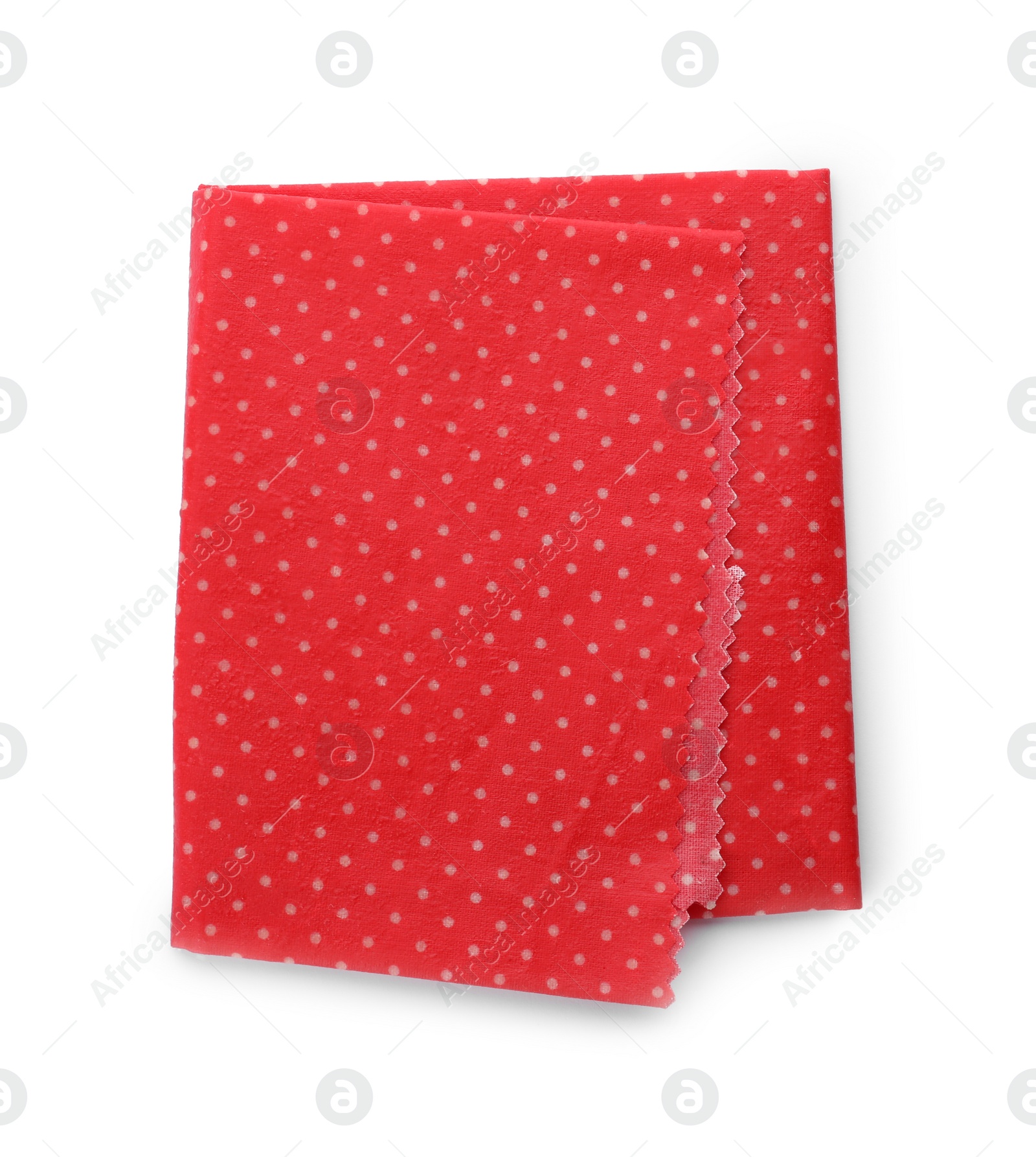 Photo of Red reusable beeswax food wrap on white background, top view