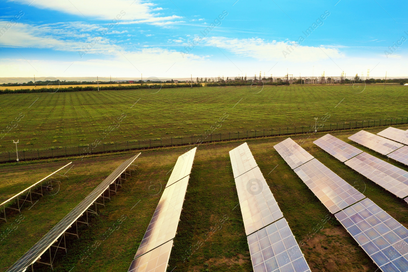 Photo of Solar panels installed outdoors, aerial view. Alternative energy source