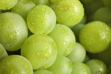 Bunch of green fresh ripe juicy grapes as background, closeup