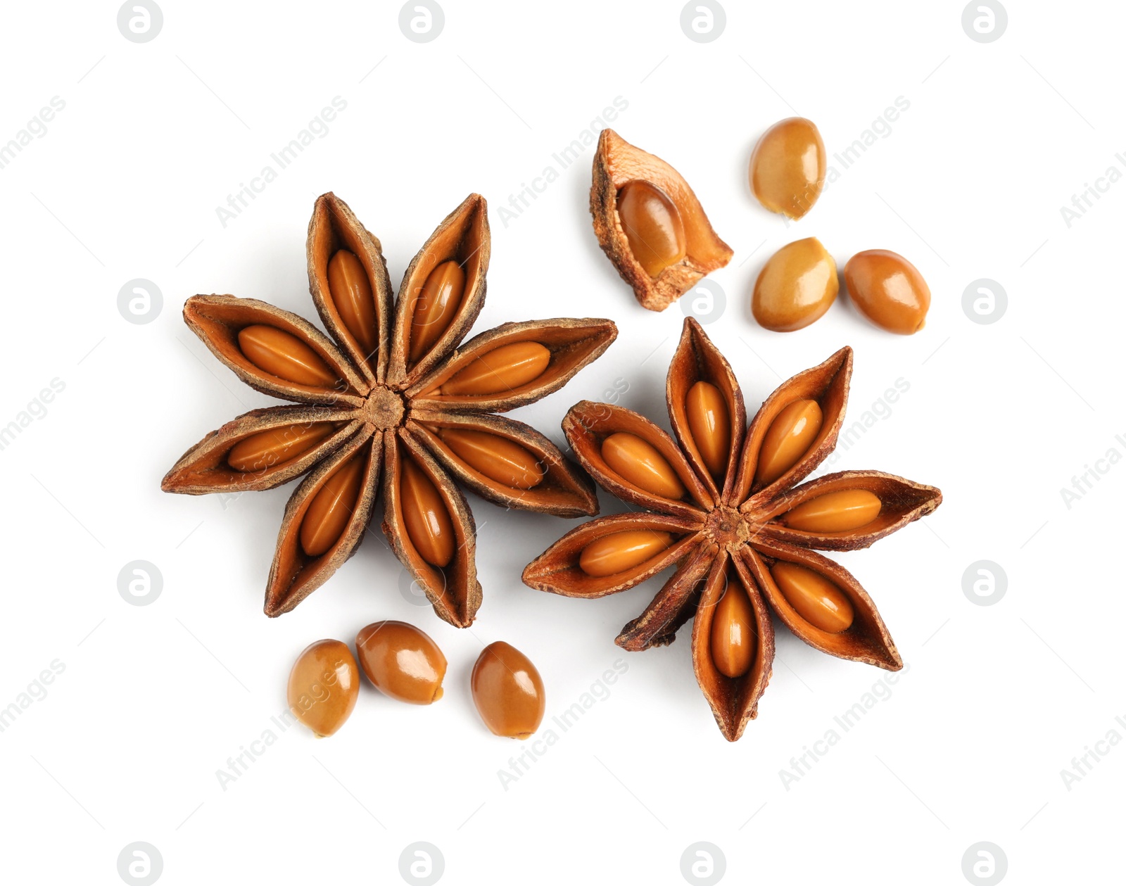 Photo of Dry anise stars with seeds on white background, top view