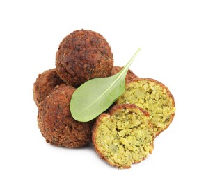 Photo of Delicious falafel balls and basil isolated on white